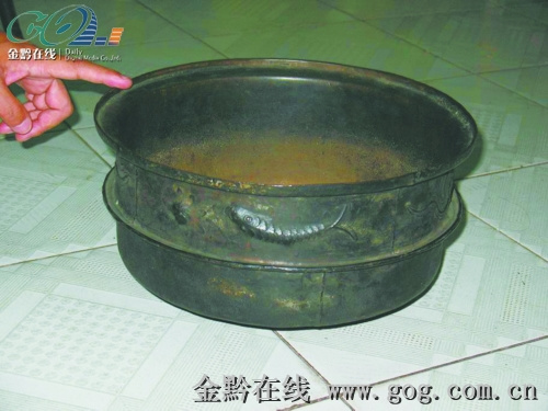 这件鱼纹黑铜锅是否元代行军锅呢？